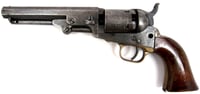 Close-up image of a revolver showing the details of its metal barrel, trigger, and wooden handle.